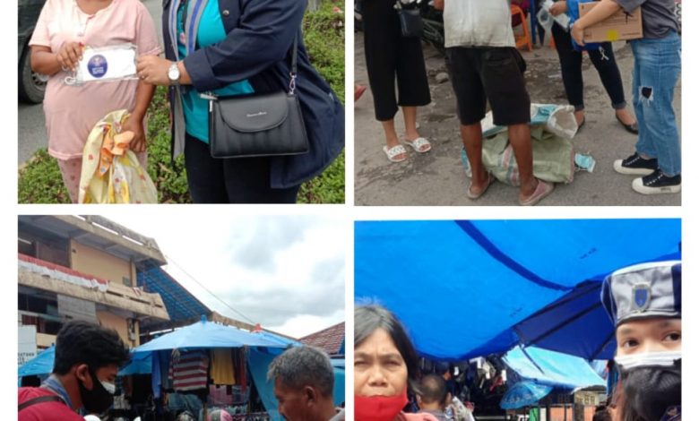 Gmki Siantar-Simalungun saat berbagi masker di Pasar Horas